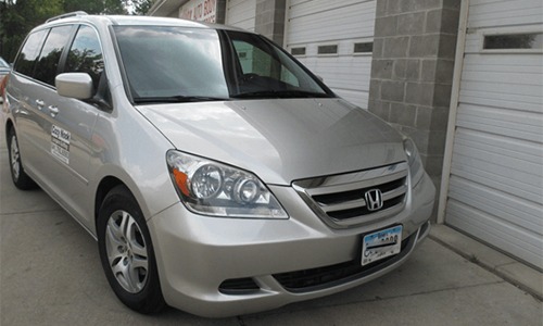 silver van front damage after