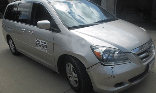 silver van front damage before